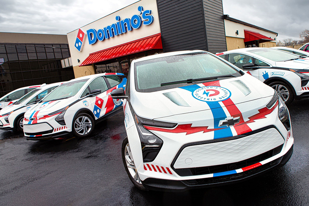 Domino’s is rolling out more than 800 custom-branded 2023 Chevy Bolt electric vehicles at select stores throughout the US