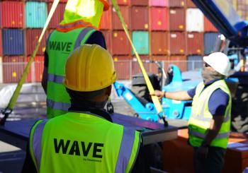 A team installs a Wave charging pad at the Port of Los Angeles