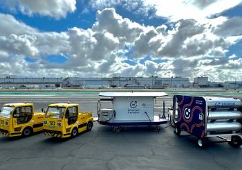 Universal Hydrogen’s recent operational demonstration at Hawthorne Airport in Los Angeles involved charging two DHL electrified tractors using a mobile AmpCart H2 prototype and portable hydrogen storage modules. Photo: Universal Hydrogen